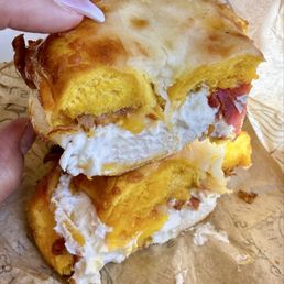 Asiago bagel breakfast sandwich (Rise n Shine) w/ cream cheese, egg, bacon, and cheddar
