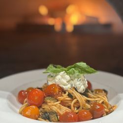 850 Degrees Pizzeria - Spaghetti with zucchini, oven blistered cherry tomatoes in a light tomato sauce. Finished with a lemon zest and basil infused ricotta