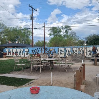 Little Dutch Garden - a table and chairs in front of a mural - Bars Near Me - Boise, Idaho Little Dutch Garden - a table and chairs in front of a mural - Bars Near Me - Boise, Idaho
