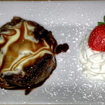 Boars Head Grill - CHOCOLATE BREAD PUDDING: chocolate custard tossed with buttery croissants; covered with chocolate sauce and vanilla anglaise - Seafood Near Me - Savannah, Georgia