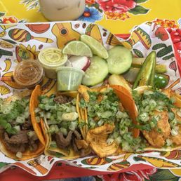 Two tacos de asada and two tacos de pollo, horchata is in the background! Two tacos de asada and two tacos de pollo, horchata is in the background!