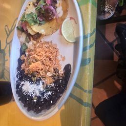 2 Taco Brisket rice and black beans. 2 Taco Brisket rice and black beans.