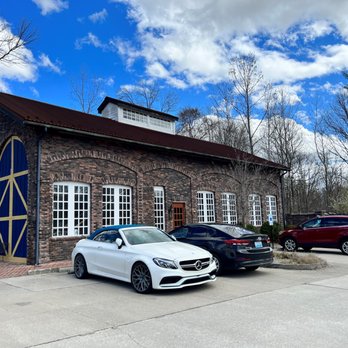 MozzaPi - two cars parked in front of a brick building - Pizza Near Me - Louisville, Kentucky