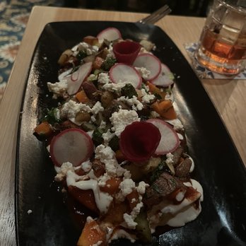 Hugo's - Deconstructed enchiladas from the vegetarian menu - Mexican Near Me - Houston, Texas