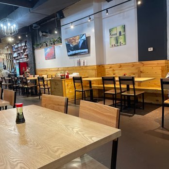 Wei Ramen - Nice restaurant seating with extra condiments in the middle - Ramen Near Me - Indianapolis, Indiana Wei Ramen - Nice restaurant seating with extra condiments in the middle - Ramen Near Me - Indianapolis, Indiana