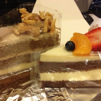 85°C Bakery Cafe-Irvine - Coffee Creme Brûlée cake on the left and Orange Breeze cake to the right- $2.80 and $2.90 respectively - Coffee & Tea Near Me - Irvine, California 85°C Bakery Cafe-Irvine - Coffee Creme Brûlée cake on the left and Orange Breeze cake to the right- $2.80 and $2.90 respectively - Coffee & Tea Near Me - Irvine, California