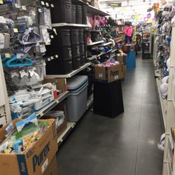 Dollar General - Cases repurposed as displays, narrowing the aisles and making them difficult to navigate with a shopping cart