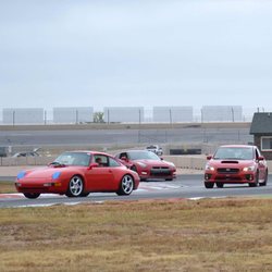 Speedy Roo Motorsports & Repair - the WRX at the track, holding its own with the Porsche (but not the GT-R behind it!)