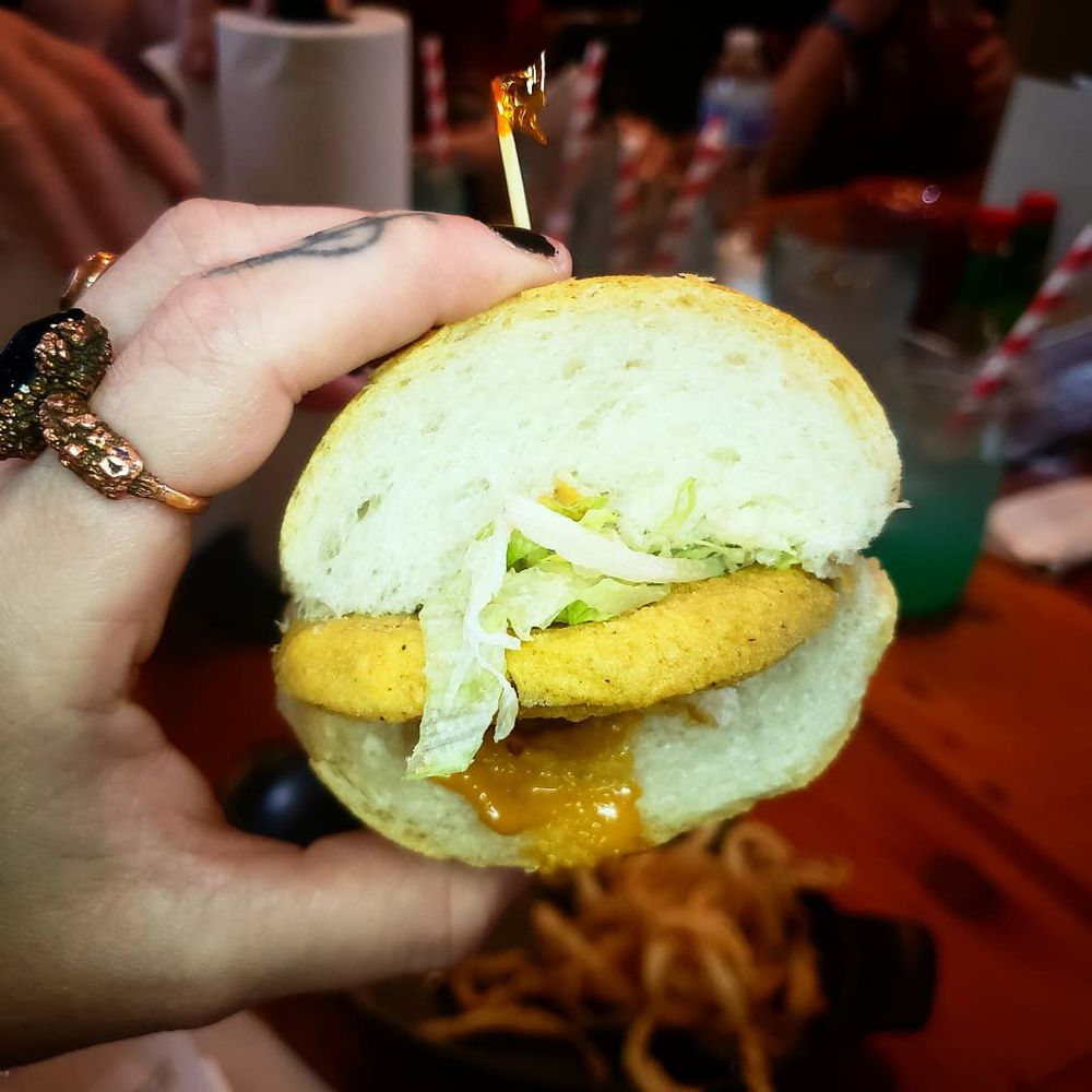 New Orleans Secrets Tours - Fried green tomatoes poboy from mahoneys - Food Tours Near Me New Orleans Secrets Tours - Fried green tomatoes poboy from mahoneys - Food Tours Near Me