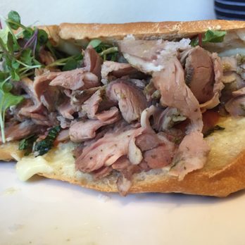 Jaleo - Roasted lamb-sliced lamb, tomatoes, olives on ciabatta with aioli - Spanish Near Me - Washington, DC, District of Columbia