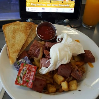 Mill City Tavern - Corned Beef Hash w Poached Eggs and OJ - Burgers Near Me - St Paul, Minnesota Mill City Tavern - Corned Beef Hash w Poached Eggs and OJ - Burgers Near Me - St Paul, Minnesota