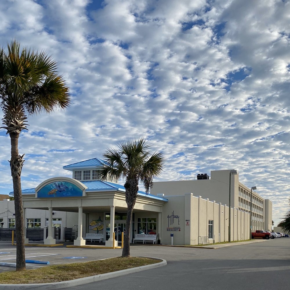 Guy Harvey Resort St Augustine Beach - Forward building is check in, restaurant/bar and gift shop. Hotel rooms are in the building behind. - Resorts Near Me - Saint Augustine Beach, Florida Guy Harvey Resort St Augustine Beach - Forward building is check in, restaurant/bar and gift shop. Hotel rooms are in the building behind. - Resorts Near Me - Saint Augustine Beach, Florida