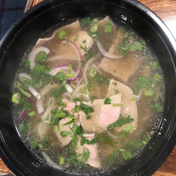 Pho King Express - a bowl of soup on a table - Vietnamese Near Me - Atlanta, Georgia