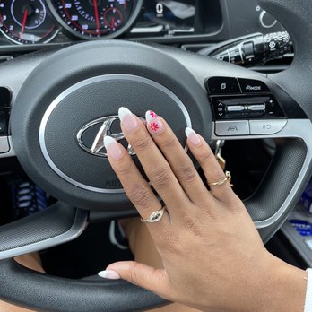 Modern Nails - french tip with flower accent nail - Nail Salons Near Me - Ames, Iowa Modern Nails - french tip with flower accent nail - Nail Salons Near Me - Ames, Iowa