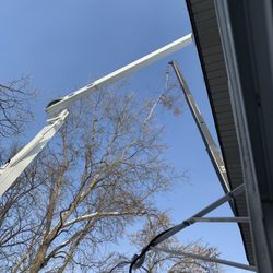 Collins Tree Care & Removal - Crane used to remove large tree