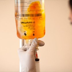 Instadrip IV - Mobile IV Los Angeles - Close-up of a mobile IV nurse preparing a vitamin infusion drip in Los Angeles.