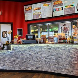 Chicken 4U - Order for take out at counter. Pretty large menu posted above.