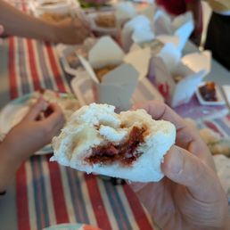 Cross section of my steamed BBQ pork bun (char siu bao). Dim sum food delivery from Ming's Tasty Restaurant of Oakland, California. Cross section of my steamed BBQ pork bun (char siu bao). Dim sum food delivery from Ming's Tasty Restaurant of Oakland, California.