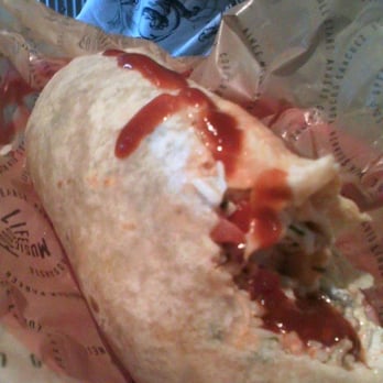Chipotle Mexican Grill - Carnitas Burrito...missing a bite! - Mexican Near Me - Newton, Massachusetts Chipotle Mexican Grill - Carnitas Burrito...missing a bite! - Mexican Near Me - Newton, Massachusetts