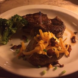 Delmonico Bison with loaded baked potato and broccoli Delmonico Bison with loaded baked potato and broccoli