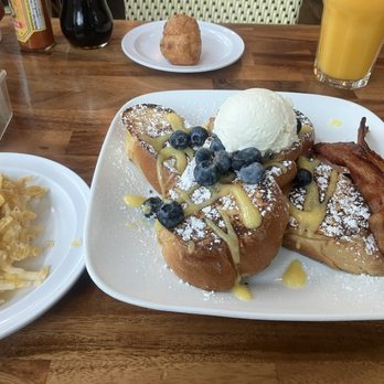 Cheryl’s on 12th - The French Toast Challah Bread with blueberries, lemon curd, and whipped cream, side of bacon, and Side Cheesy Hash Browns. Delicious. - Breakfast & Brunch Near Me - Portland, Oregon Cheryl’s on 12th - The French Toast Challah Bread with blueberries, lemon curd, and whipped cream, side of bacon, and Side Cheesy Hash Browns. Delicious. - Breakfast & Brunch Near Me - Portland, Oregon