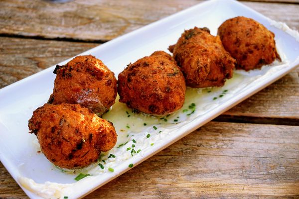 Photo of The White Swan Public House - Seattle, WA, US. Crab Hushpuppies: honey butter ($16).