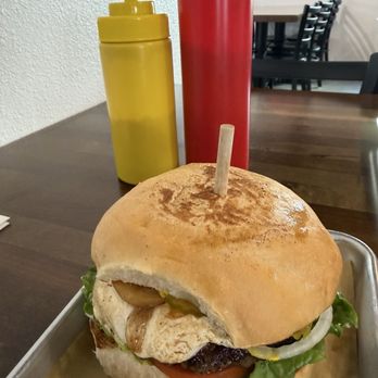 Ranch Road Burgers - Burger with goat cheese, grilled garlic, lettuce, tomatoes, pickles, onions. - Burgers Near Me - Stonewall, Texas