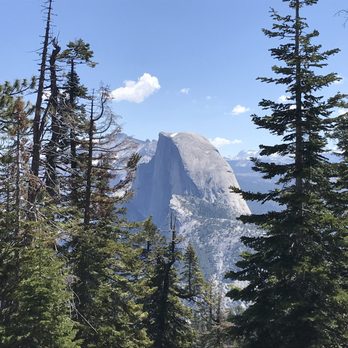 Sentinel Dome & Taft Point - A sneak peek of Half Dome along the trail - Hiking Near Me
