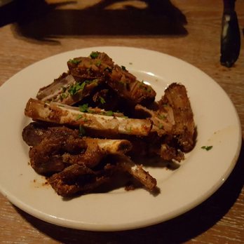Black Bottle - Meat -- dry rub house-smoked wild boar ribs. Pretty small. - New American Near Me - Bellevue, Washington