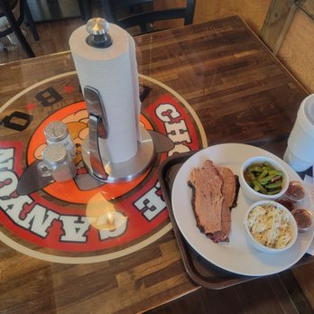 Choke Canyon BBQ - Dining table with meal - Barbeque Near Me - Schulenburg, Texas Choke Canyon BBQ - Dining table with meal - Barbeque Near Me - Schulenburg, Texas