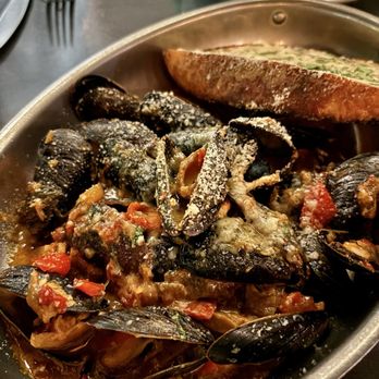 Brulé Bistro - Mussels in a tomato sauce. Fresh and good- just non traditional. May disappoint if you prefer the wine/broth style. - New American Near Me - Delray Beach, Florida