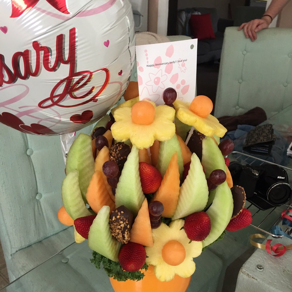 a fruit arrangement in a vase