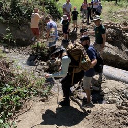 Stone Pantry Orchard - Holding onto a rope to go across a mini creek (Sep 2023)