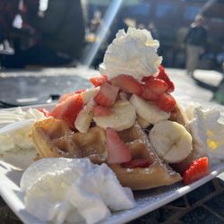 Café Amor - Waffle with strawberries, bananas + whipped cream of course!