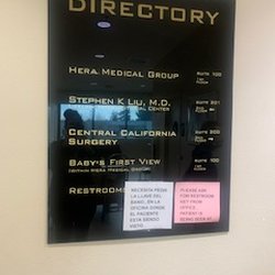 Central California Surgery - February 13, 2024 Impossible to tell what these pieces of pink & white paper are doing on this professional sign. It looks unprofessional.