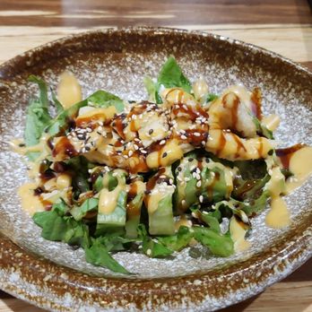 Kyoto - When I first sat down I was greeted with this beautiful appetizer. Lettuce, fried fish, tasty sauces over the top. - Japanese Near Me - Kearney, Nebraska