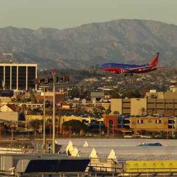 Theme Building - In the distant you can see the Hollywood sign. - Landmarks & Historical Buildings Near Me - Los Angeles, California Theme Building - In the distant you can see the Hollywood sign. - Landmarks & Historical Buildings Near Me - Los Angeles, California