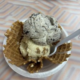 Cookies and cream and oatmeal cookie ice cream in waffle bowl Cookies and cream and oatmeal cookie ice cream in waffle bowl