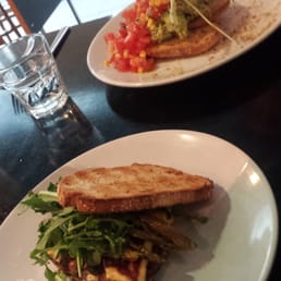 Halloumi "light bite" and smashed avocado in the background Halloumi "light bite" and smashed avocado in the background