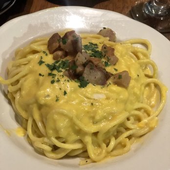 Monello - Spaghetti noodles, yellow bell pepper sauce and pork cheek cheese wheel dinner - Italian Near Me - San Diego, California Monello - Spaghetti noodles, yellow bell pepper sauce and pork cheek cheese wheel dinner - Italian Near Me - San Diego, California