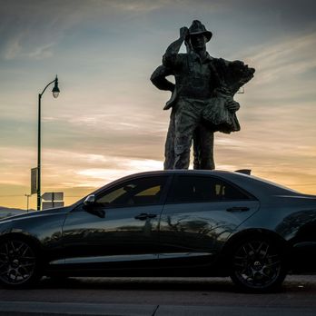 Darkside Window Tinting - Beautiful shot of the Cadillac with the Tracy railroad monument downtown - Car Window Tinting Near Me