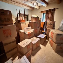 Storage Unlimited - Basement room of dumped boxes