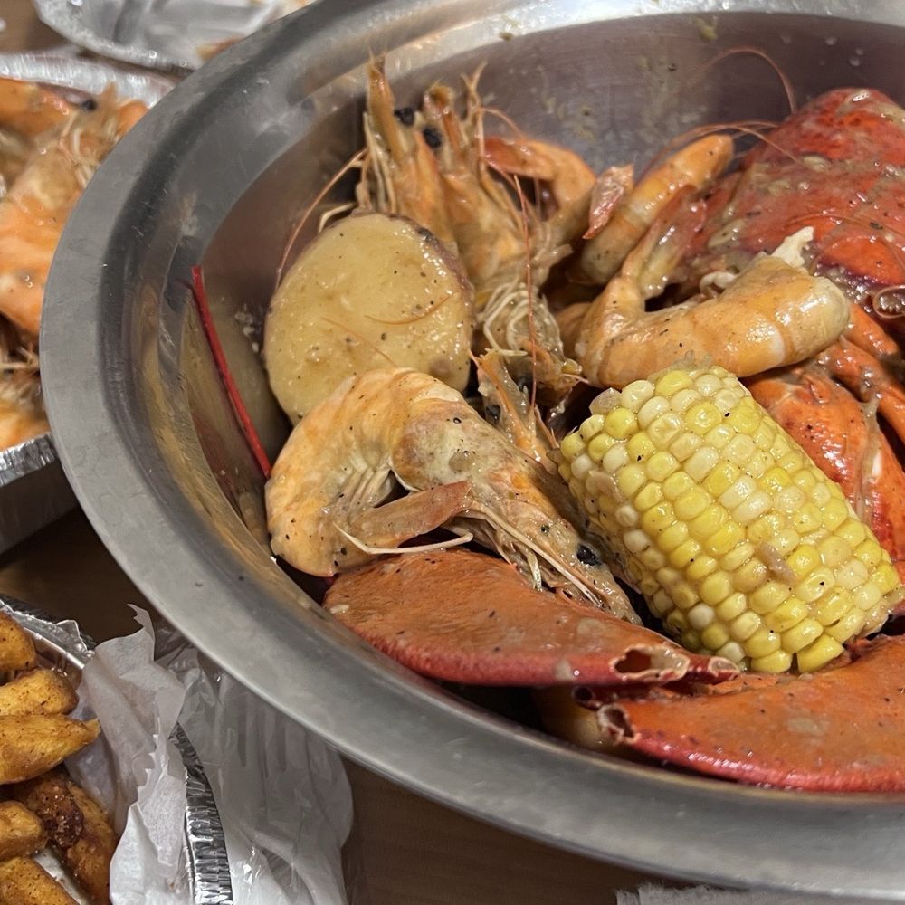 Whole lobster and 1lb shrimp (in bowl), 1lb shrimp (in aluminum takeout container), French fries Whole lobster and 1lb shrimp (in bowl), 1lb shrimp (in aluminum takeout container), French fries