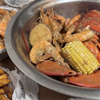 Oceanic Boil - Whole lobster and 1lb shrimp (in bowl), 1lb shrimp (in aluminum takeout container), French fries - Cajun/Creole Near Me - Jackson Heights, New York