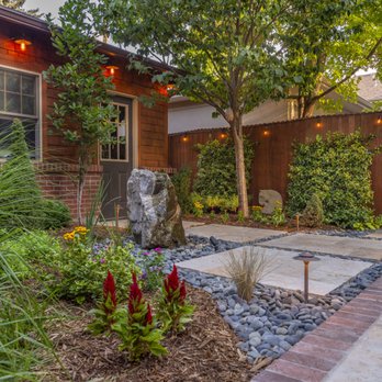 Denver Landscapes - Modern patio of premium buff flagstone surrounded by a timeless brick border that perfectly accents the existing brick façade of the residen - Landscape Architects or Designers Near Me - Denver, Colorado