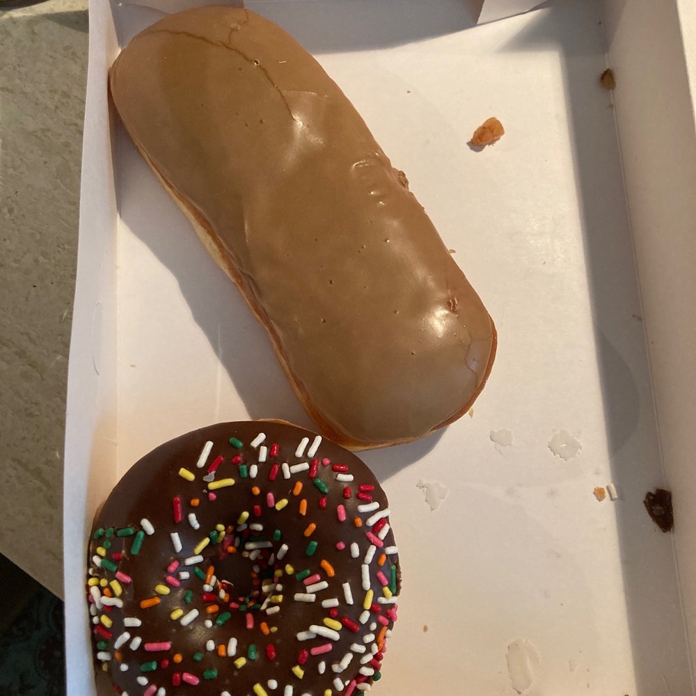 The Donut Palace - Maple Long John and a plain cake donut with chocolate frosting - Donuts Near Me - Wichita, Kansas The Donut Palace - Maple Long John and a plain cake donut with chocolate frosting - Donuts Near Me - Wichita, Kansas