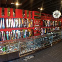 Phase 2 Skateshop - The board wall and truck and wheel cases at the Wauwatosa location. We usually stock about 200 decks at all times.