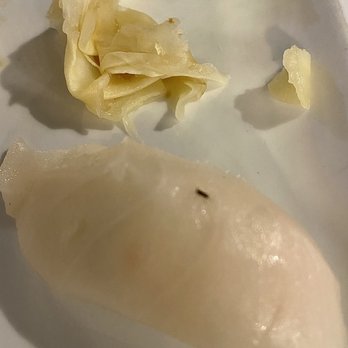 AKA Sushi - Nigiri with fruit fly garnish. - Sushi Bars Near Me - Jackson, Michigan