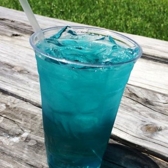 Eskimo Hut - a blue drink on a picnic table - Convenience Stores Near Me - Denton, Texas