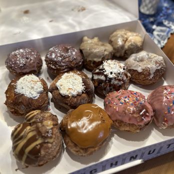Parlor Doughnuts - Top row- Blueberry Hill, French toast Middle row- Coconut, cookies and creme, Sandy Beach Bottom Row- Peanut Butter, Bourbon, Strawberry - Donuts Near Me - Bolingbrook, Illinois